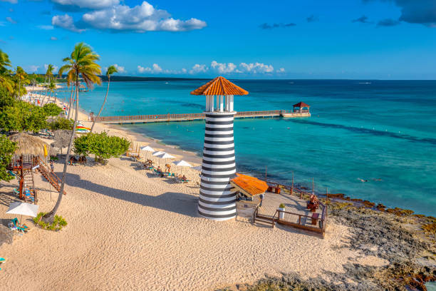 istock Aerial view of a striped lighthouse at a beach 1442680000