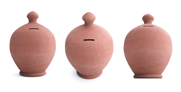 A clay coin boxes named gullaq handmade in India on the white background