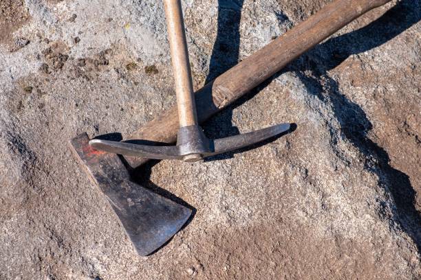 istock Pickaxe and axe, tools in an archaeological excavation. Archeology 1442681801