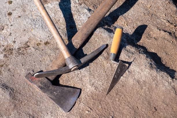 istock Pickaxe, trowel and axe, tools in an archaeological excavation 1442681804