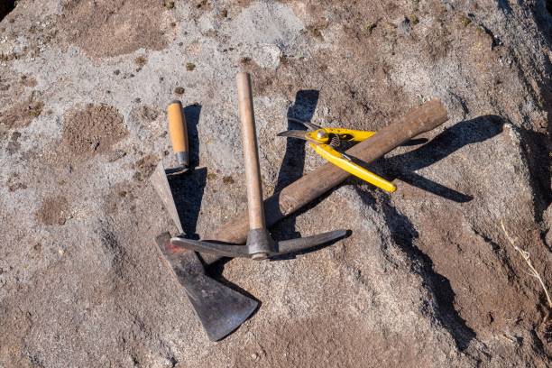 istock ArcheologyPickaxe, trowel, pruning shears and axe, tools in an archaeological excavation. 1442681806