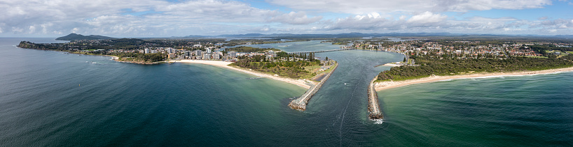 An aerial panorama view of the beach and harbor at Forster in New South Wales, Australia