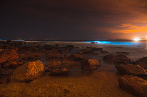 A beautiful view of rocky seashore at night in Puerto Rico