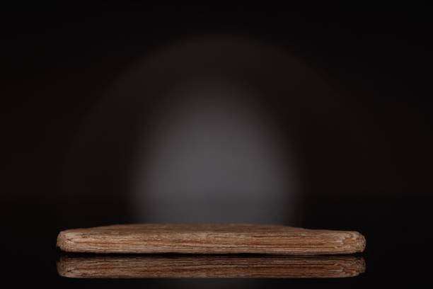 istock Naturl podium for product presentation on a black background 1442685046