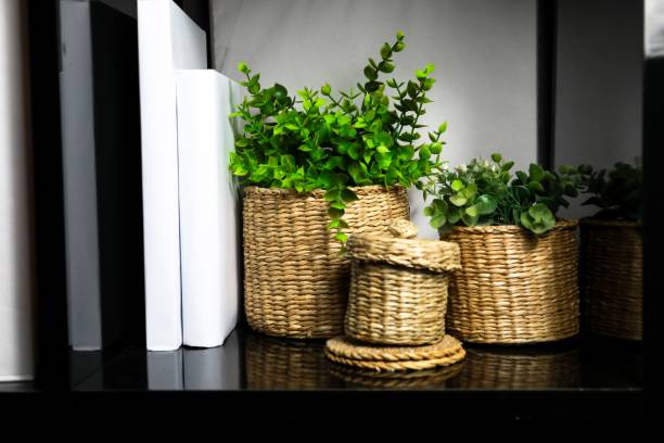 istock Close-up shot of wicker planters placed on a shelf 1442685371
