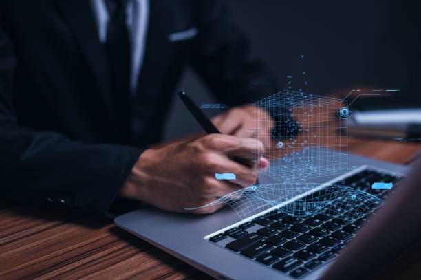 istock Successful businessman working on his laptop - metaverse digital cyber world technology concept 1442685836