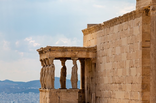 The Porch of the Caryatids in Acropolis, Greece against a blue sky