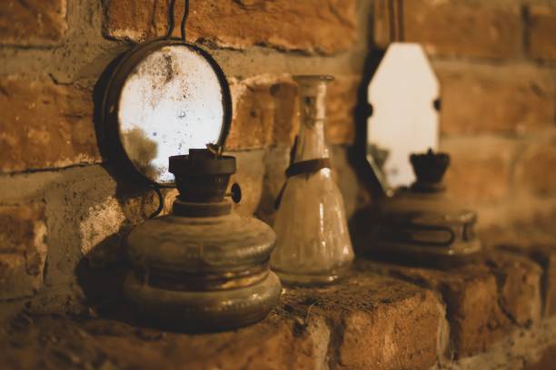 istock Wall with old dirty mirrors on it and lantern lamps in dust 1442687158
