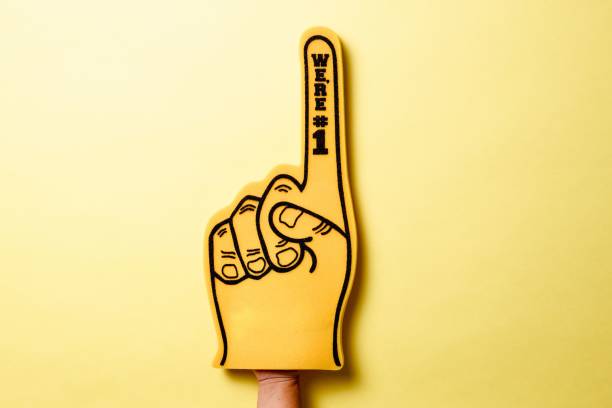 istock Yellow foam hand on yellow background 1442687247
