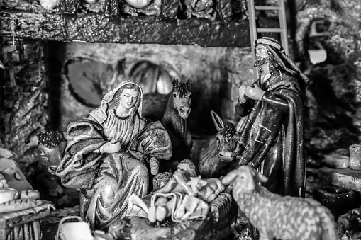 A grayscale shot religious sculpture figurines of the Nativity scene