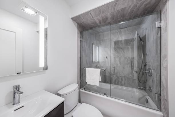 istock Stylish bathroom with a glass partitioned bathtub 1442690203