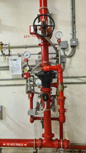 istock Vertical shot of a fire extinguishing system with red tubes 1442690764