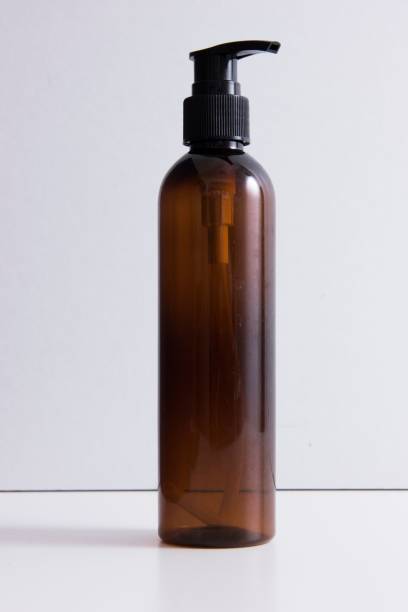 istock Brown transparent bottle for shampoo isolated on white background 1442691082