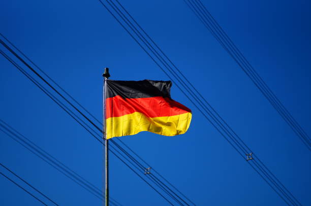 istock German flag in front of high-voltage power lines. 1442694122