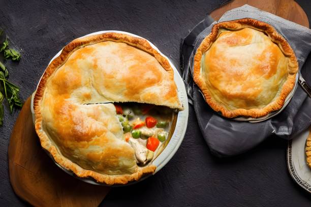 istock Top view of pot pies on a grey background. 1442694342