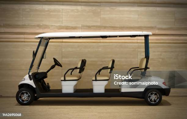 White Golf Cart Isolated On Wooden Background Stock Photo - Download Image Now - Car, Carriage, Business