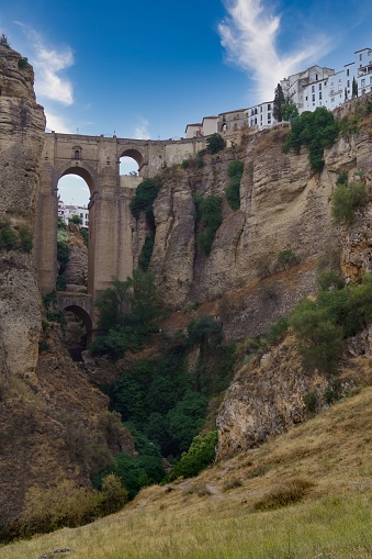 views from the river of the new bridge of Ronda over the cliff .Andalusia, Spain