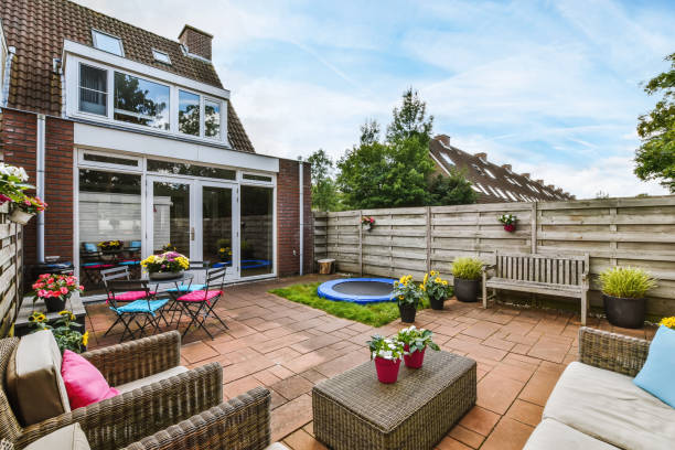 istock Beautiful shot of a modern backyard with nice chairs and a trampoline 1442696814