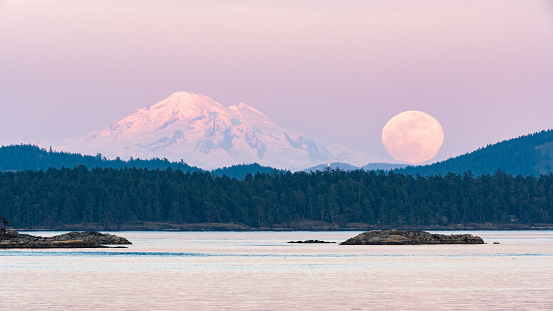 A serene view ofSupermoon over Mount Baker in Washington state taken from Sidney, BC Canada (on Vancouver Island)