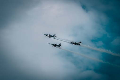 Krakow, Poland – August 28, 2022: The old airplanes flying in the sky during the Polish aviation day.