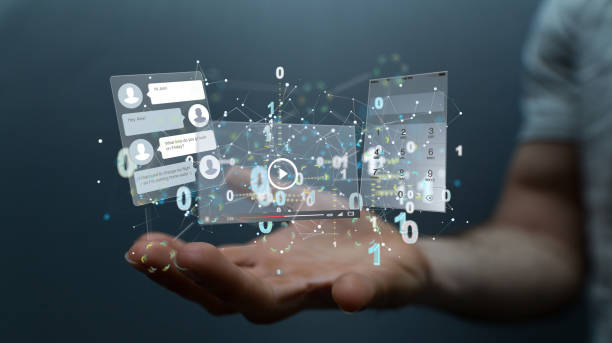 istock 3d rendered hologram of chat, phone, and online video interfaces hovering over a man's palm 1442698260