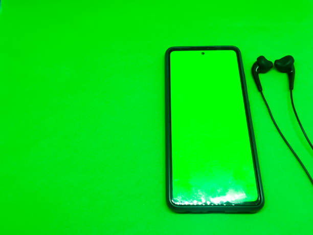 istock mobile smartphone with green screen connect to earphone 1442703647