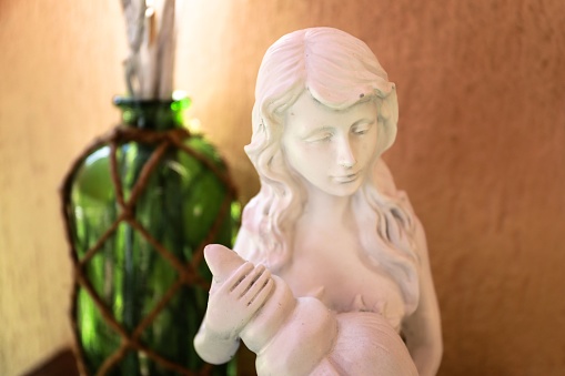 A mermaid statue figurine decoration with a shell