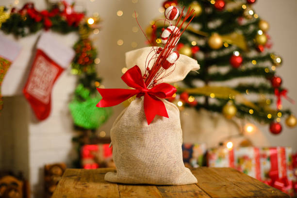 istock Gift bag in foreground with Christmas background. 1442704646