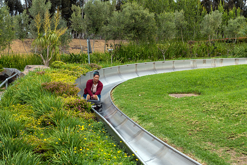 Bellville, South Africa - Sep 17, 2022: Tobogganing at Cool Runnings in Bellville in the Western Cape Province. A person is visible