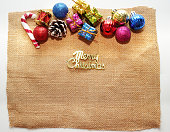 istock christmas template decorated frame by bell,ribbon,bowtie,pine cone,present box,cane top view 1442716607