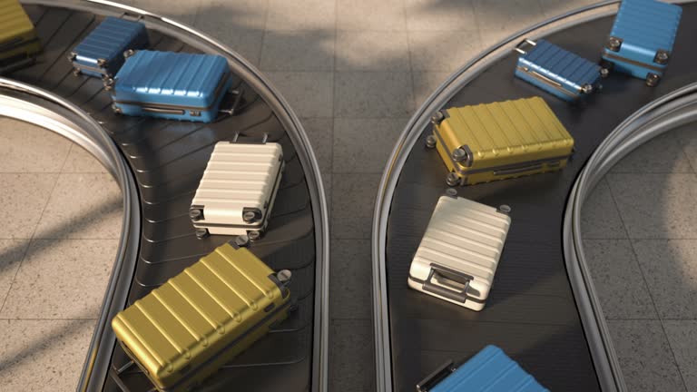 A conveyor with suitcases in the arrival area of the airport. Luggage is moved on a transport belt. The concept of travel and business trips.