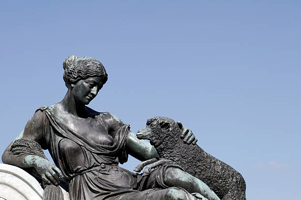 Female With Sheep Statue stock photo