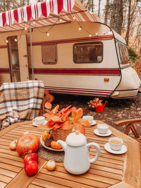 istock Table and chairs outside trailer in nature 1442724105
