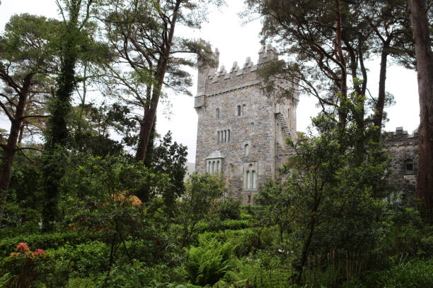 Ballysaggartmore Towers is a historic site located in County Waterford, Ireland. The site is home to a set of stunning ruined towers that were built in the mid-19th century by a wealthy landowner named Arthur Kiely-Ussher.The towers were designed as an elaborate entrance to the Kiely-Ussher estate and were intended to impress visitors with their grandeur and opulence. The towers are built in a Gothic Revival style and feature ornate carvings, intricate stonework, and a variety of other decorative elements.Despite their impressive appearance, the towers were never fully completed, and by the end of the 19th century, they had fallen into disrepair. Today, they are a popular tourist attraction and are considered an important part of Ireland's architectural heritage.Visitors to Ballysaggartmore Towers can explore the ruins and learn about the history of the site through interpretive displays and guided tours. The site is also a popular spot for hiking and nature walks, with several trails winding through the surrounding woods and countryside.