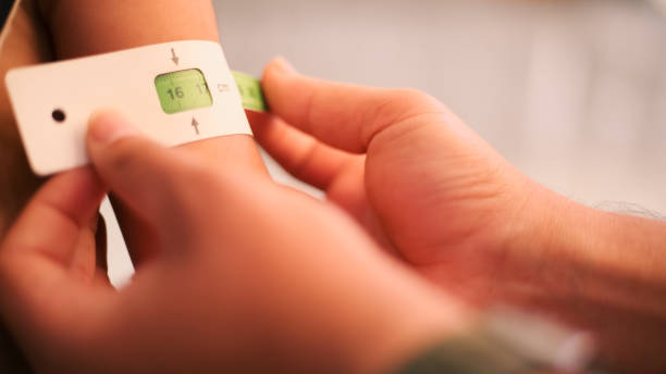 istock A doctor examines children's malnutrition inside a refugee camp 1442725161