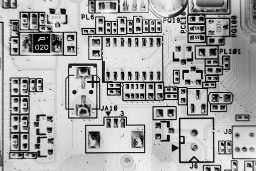black and white . resistors on the printed circuit board. The concept of electro and microprocessor technologies. Selective focus Printed-Circuit Board Macro Background. pcb.