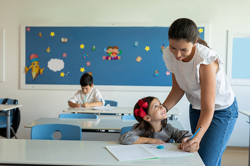 Teacher helping a student