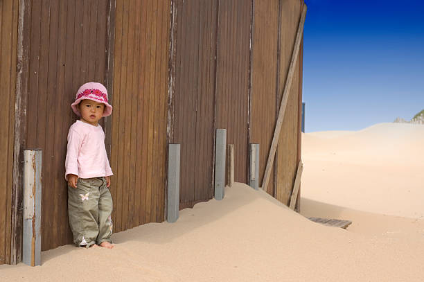 little girl on the beach stock photo