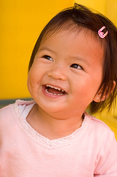 close up of little asian girl with a smile stock photo