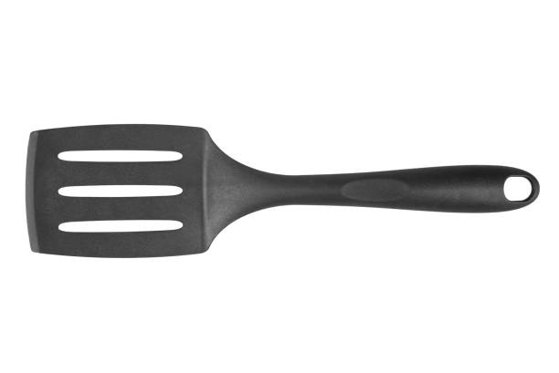 istock Black plastic cooking spatula isolated on white background. Kitchen utensils. 1442727805