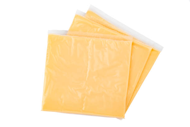 istock Processed cheese for making hamburgers and cheeseburgers wrapped in clear transparency plastic package isolated on white background. 1442727922