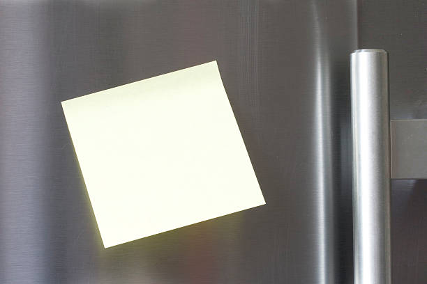 Post it on the fridge stock photo