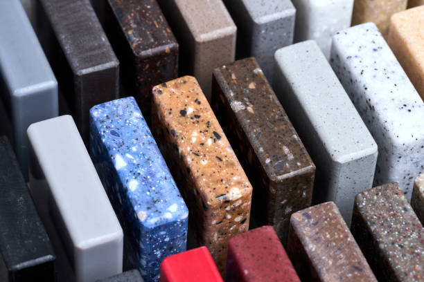 istock Porcelain stoneware square samples as kitchen countertop examples of future kitchen fasade exterior. Samples slabs of natural granite marble quartz for stone countertops close up. 1442730273