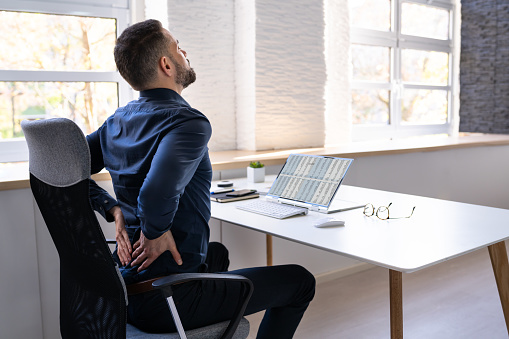 Man With Back Pain. Bad Office Posture