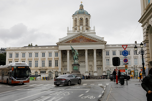 Brussels, Belgium - September 17, 2022: The Church of St. James on Coudenberg with an equestrian statue of Godfrey of Bouillon situated in the Place Royale of Brussels