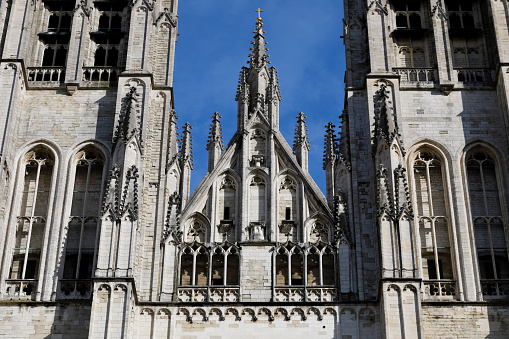 Brussels, Belgium - September 17, 2022: Architectural detail at the front, above the gate to the Cathedral of St. Michael and St. Gudula, which is located in the central part of the city.