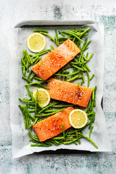 Salmon fillet portion prepared salmon fillet portions ready for oven cooking. salmon stock pictures, royalty-free photos & images