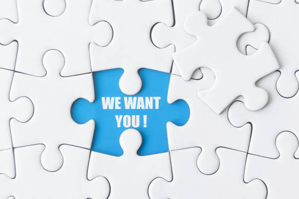 istock White puzzle with one missing piece shows: WE WANT YOU! 1442735583