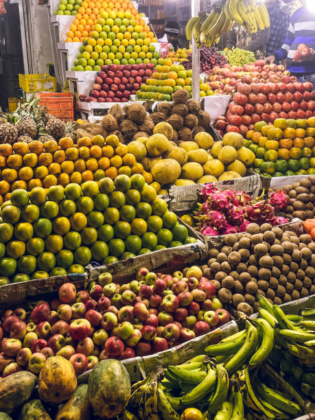 Various fruits arranged in front of a shop