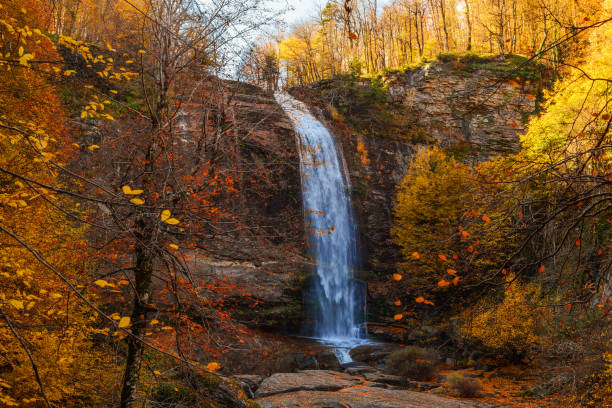 istock waterfall landscape in autumn 1442741469